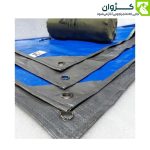 گوشه پانچ‌شده زیرانداز موتال با کاور حمل در کنار آن