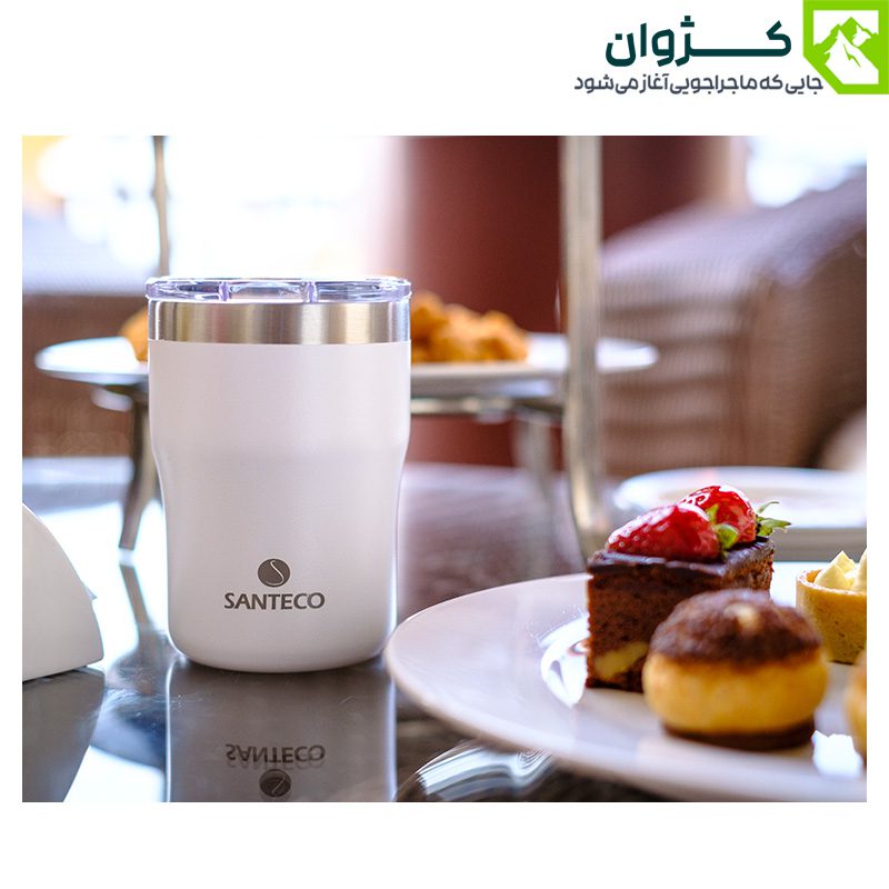 لیوان سفید SANTECO مدل NORA روی میز کنار شیرینی