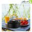 کتری کمپینگ BLACK DEER مدل K02 رنگ مشکی روی میز فضای باز در کنار نوشیدنی و خوراکی‌های پیک‌نیکی